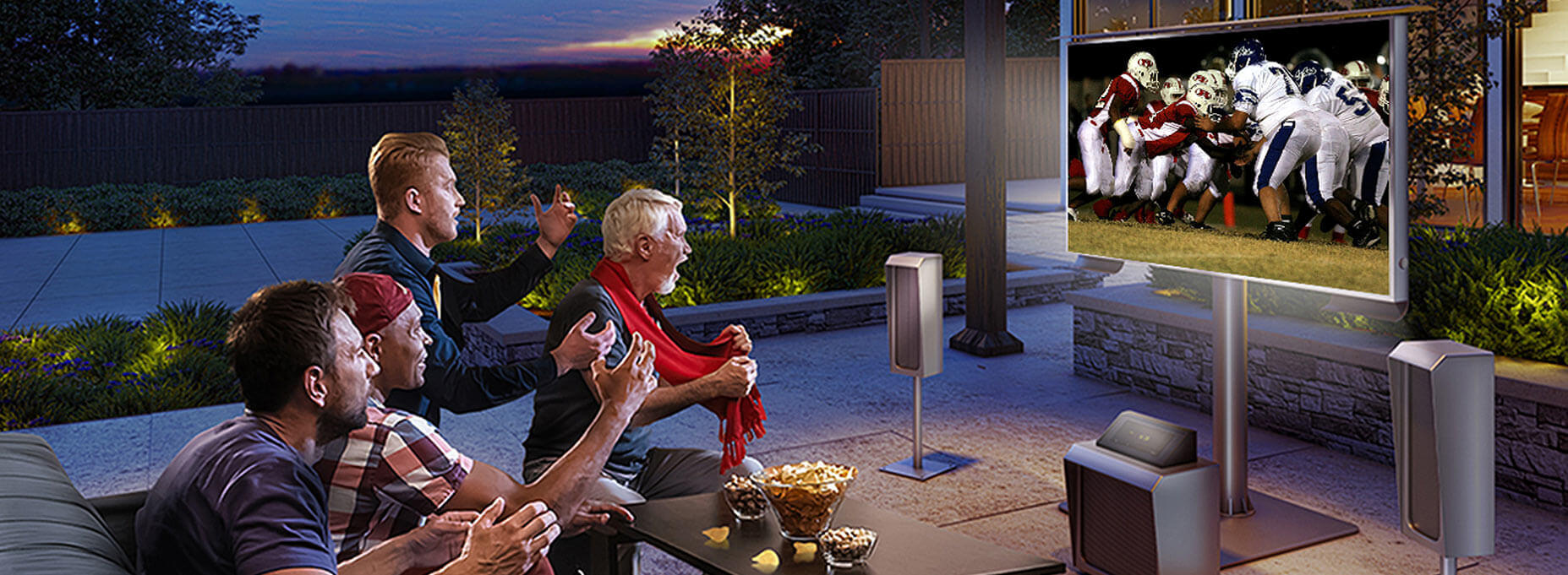 Group of men in a patio watching an American football in a cool looking outdoor TV with its speakers and subwoofers.