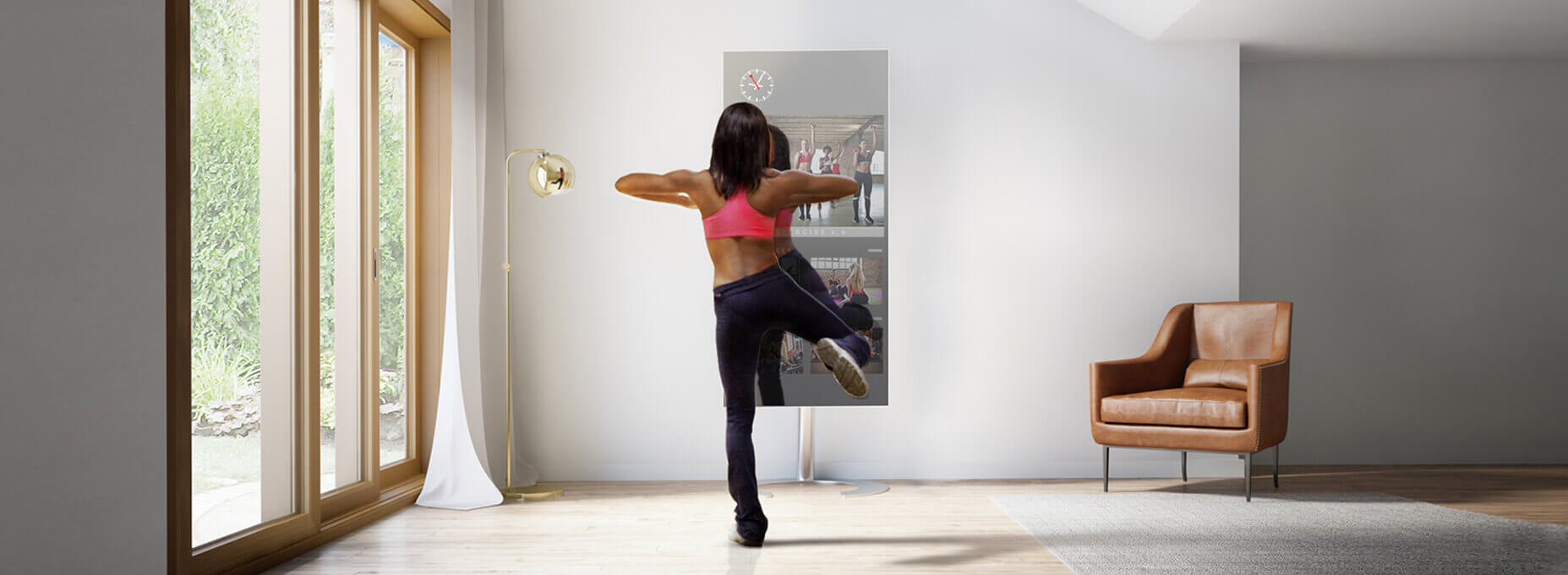 A woman in workout clothes having her workout class online through the use of smart fitness TV in the comfort of her home.
